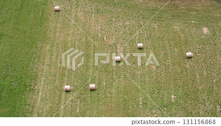 Aerial view Haystacks on the harvest fields in summertime, Zdencina, Croatia Aerial view Haystacks on the harvest fields in summertime, Zdencina, Croatia 131156868