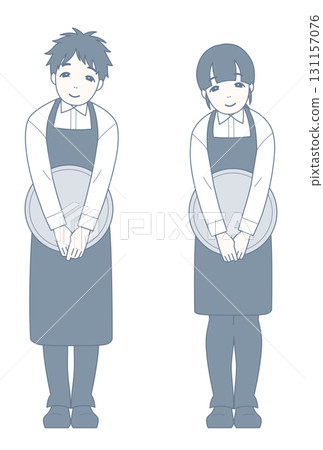 A smiling restaurant employee bows slightly 131157076