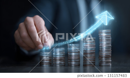 businessman stacking coins with futuristic upward arrow hologram 131157483