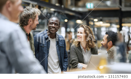 diverse group of traders exchanging ideas in coworking office 131157493