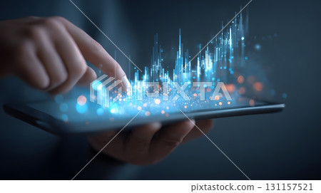 hands holding transparent tablet with glowing investment data 131157521