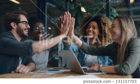startup founders celebrating breakthrough idea with high five 131157783