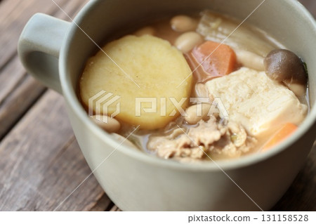 Pork miso soup with lots of sweet potatoes served in a soup cup 131158528