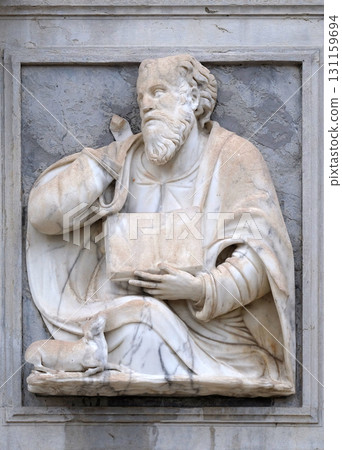 Saint Luke the Evangelist relief on the portal of the Cathedral of Saint Lawrence in Lugano, Switzerland 131159694