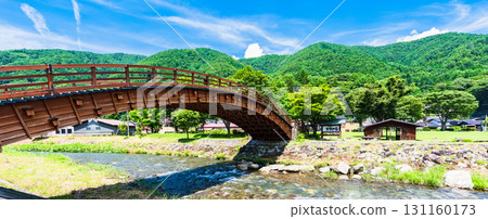 Naraijuku Kiso Ohashi Bridge is an arched bridge made entirely of cypress wood spanning the Narai River. [Sightseeing in Shiojiri City, Nagano Prefecture] 131160173