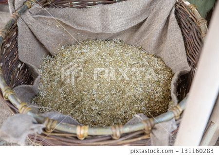 dried medicinal herbs, chamomile flowers in a cotton bag dried medicinal herbs, chamomile flowers in a cotton bag 131160283