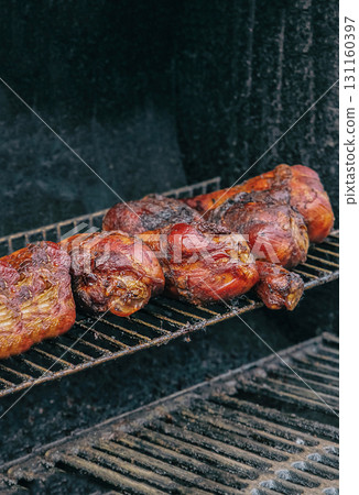 turkey meat row of legs fried with appetizing crust on a grill grill 131160397