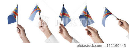 The Democratic Republic of the Congo flag in hand in different angles on a white background The Democratic Republic of the Congo flag in hand in different angles on a white background 131160443