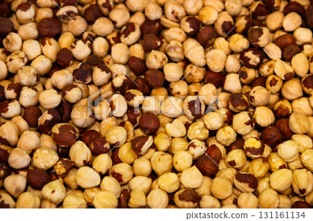 Hazelnut fried kernels. Close-up. Background for snacks and nuts Hazelnut fried kernels. Close-up. Background for snacks and nuts 131161134