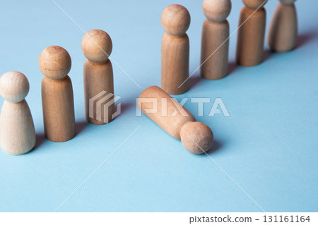 Wooden peg doll falling down from a group line 131161164