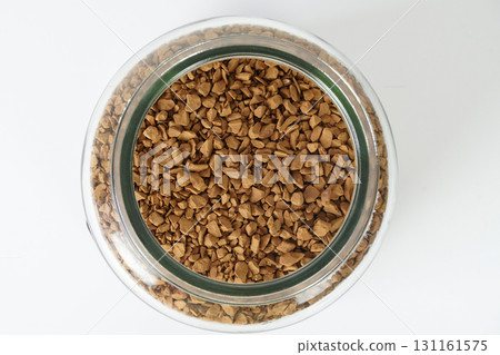 Close up top view of freeze dried instant coffee in a glass jar 131161575