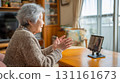 Elderly woman having a daytime video call at home 131161673
