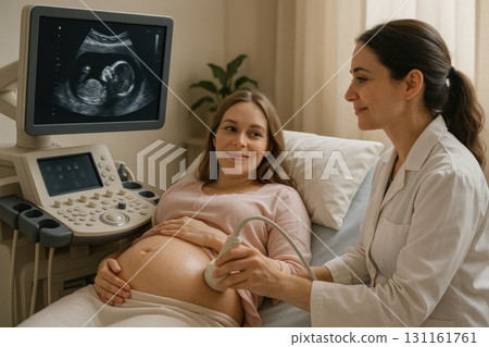 Expectant mother receives ultrasound examination in a clinic with a healthcare professional providing care and support 131161761