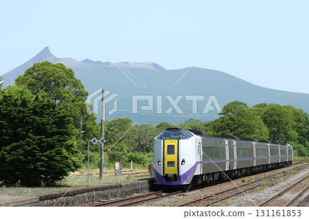 Limited Express Hokuto Kiha 261 Series Kiha 261 entering Onuma Station with Mount Komagatake in the background 131161853