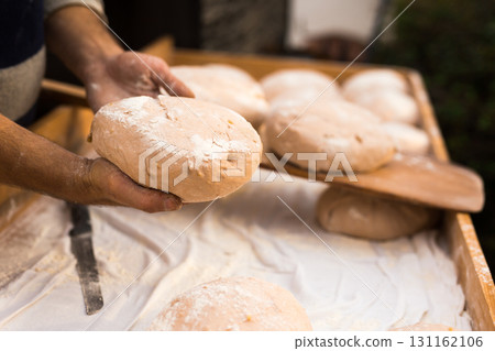 bread preparation. loaves of dough before baking bread preparation. loaves of dough before baking 131162106