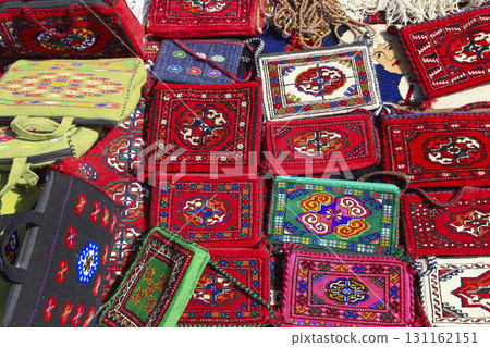 Handmade decorative bags and carpets with traditional ornament. Turkmenistan. Ashkhabad market. 131162151