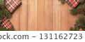 Rustic wooden background with Christmas gifts and pine branches 131162723