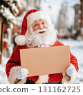 Santa Claus holding blank sign in snowy winter scene 131162725