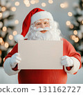 Santa Claus holding blank sign in festive winter setting 131162727