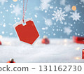 Red tag hanging in snow with festive decorations and snowflakes 131162730