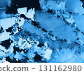 Aerial drone view of cracked ice floes on frozen lake surface 131162980