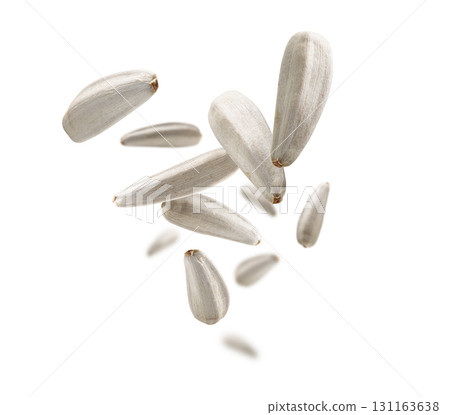 White sunflower seeds levitate on a white background White sunflower seeds levitate on a white background 131163638
