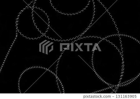 Round shapes of stretched metal springs on black background surface Round shapes of stretched metal springs on black background surface 131163905