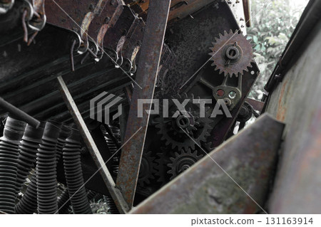 Rusty and grungy rural technical device background with visible different parts 131163914