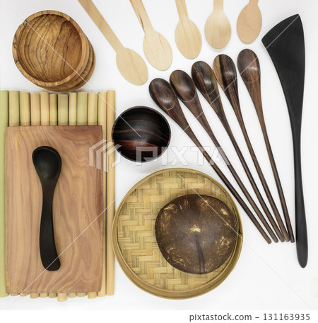 Set of wooden tableware on white background 131163935