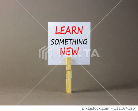 Learn something new symbol. Concept words Learn something new on beautiful white paper on clothespin. Beautiful grey background. Business motivational learn something new concept. Copy space. Learn something new symbol. Concept words Learn something new on beautiful white paper on clothespin. Beautiful grey background. Business motivational learn something new concept. Copy space. 131164180