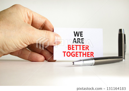 We are better together symbol. Concept words phrase We are better together on beautiful white card. Businessman's hand. Beautiful white background. Business We are better together concept Copy space We are better together symbol. Concept words phrase We are better together on beautiful white card. Businessman's hand. Beautiful white background. Business We are better together concept Copy space 131164183