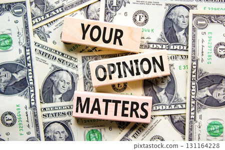 Your opinion matters symbol. Concept words Your opinion matters on beautiful wooden blocks. Dollar bills. Beautiful background from dollar bills. Business your opinion matters concept. Copy space. Your opinion matters symbol. Concept words Your opinion matters on beautiful wooden blocks. Dollar bills. Beautiful background from dollar bills. Business your opinion matters concept. Copy space. 131164228