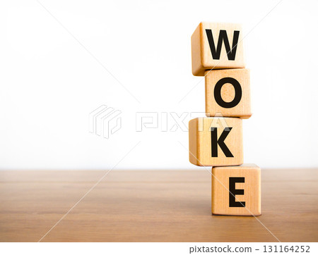 Woke question symbol. Concept word Woke question on beautiful wooden blocks. Beautiful wooden table white background. Business, lifestyle, support and woke question concept. Copy space. Woke question symbol. Concept word Woke question on beautiful wooden blocks. Beautiful wooden table white background. Business, lifestyle, support and woke question concept. Copy space. 131164252
