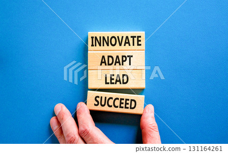 Innovate adapt lead succeed symbol. Concept words Innovate Adapt Lead Succeed on beautiful wooden blocks. Beautiful blue background. Business innovate adapt lead succeed concept. Copy space. Innovate adapt lead succeed symbol. Concept words Innovate Adapt Lead Succeed on beautiful wooden blocks. Beautiful blue background. Business innovate adapt lead succeed concept. Copy space. 131164261