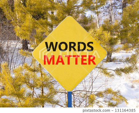 Words matter symbol. Concept word Words matter on beautiful yellow road sign. Beautiful snow winter forest background. Business words matter concept. Copy space. Words matter symbol. Concept word Words matter on beautiful yellow road sign. Beautiful snow winter forest background. Business words matter concept. Copy space. 131164385