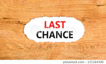 Last chance symbol. Concept word Last chance on beautiful white paper. Beautiful wooden paper background. Business last chance concept. Copy space. Last chance symbol. Concept word Last chance on beautiful white paper. Beautiful wooden paper background. Business last chance concept. Copy space. 131164390