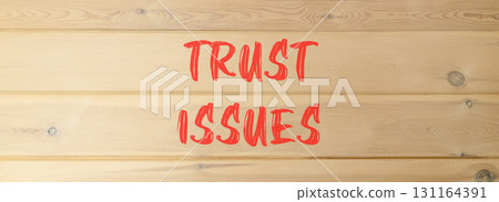 Trust issues symbol. Concept word Trust issues on beautiful wooden wall. Beautiful wooden wall background. Business trust issues concept. Copy space. 131164391