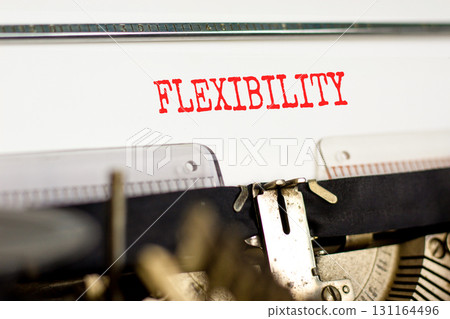 Flexibility symbol. Concept word Flexibility typed beautiful old retro vintage typewriter. Beautiful white paper background. Business flexibility concept. Copy space. Flexibility symbol. Concept word Flexibility typed beautiful old retro vintage typewriter. Beautiful white paper background. Business flexibility concept. Copy space. 131164496