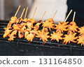 Yellow squids preparing on grill in Thailand market 131164850