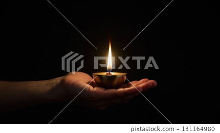 Minimalist Brass Diya Lighting Against Pure Black Background Symbolis. Dashahra, India. 131164980