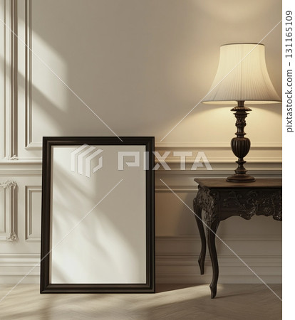 A blank, black-framed square picture frame on an ornate wooden bench against a beige wall, with a vintage floor lamp to the right and sunlight casting shadows. A blank, black-framed square picture frame on an ornate wooden bench against a beige wall, with a vintage floor lamp to the right and sunlight casting shadows. 131165109