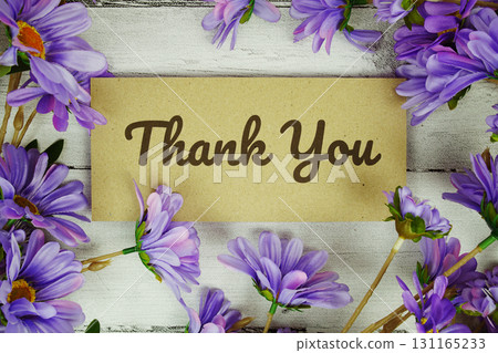 Thank You text with flowers decoration on wooden background Thank You text with flowers decoration on wooden background 131165233