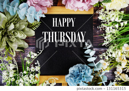Happy Thursday text with flowers bouquet decoration on wooden background 131165315