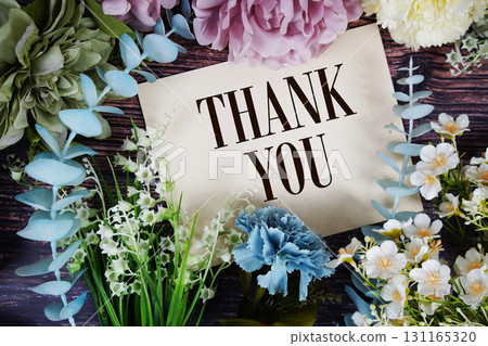 Thank You text with flowers bouquet decoration on wooden background Thank You text with flowers bouquet decoration on wooden background 131165320