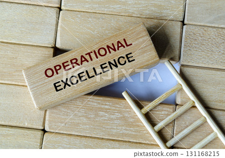 Operational excell text written on wooden blocks stacked on a wooden ladder symbolizing organizational efficiency. Operational excell text written on wooden blocks stacked on a wooden ladder symbolizing organizational efficiency. 131168215
