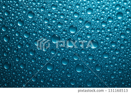 Macro close up of blue water droplets densely covering a textured background. Wallpaper concept. 131168513