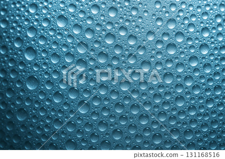 Macro close up of bright ocean blue water droplets densely covering a textured background under even lighting. Nature concept. Macro close up of bright ocean blue water droplets densely covering a textured background under even lighting. Nature concept. 131168516