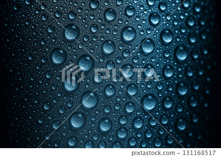 Macro close up of dark blue water droplets densely covering a textured background under uneven lighting. Wallpaper and design concept. Macro close up of dark blue water droplets densely covering a textured background under uneven lighting. Wallpaper and design concept. 131168517