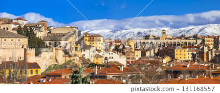 panoramic view of Segovia with aqueduct and mountains, Spain 131168557
