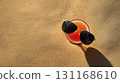 Beach cocktail with sunglasses on sand, chilled cocktail rests in warm light, glossy lenses mirror shoreline, cocktail promises slow summer rest, golden shadow and smooth texture create vacation 131168610